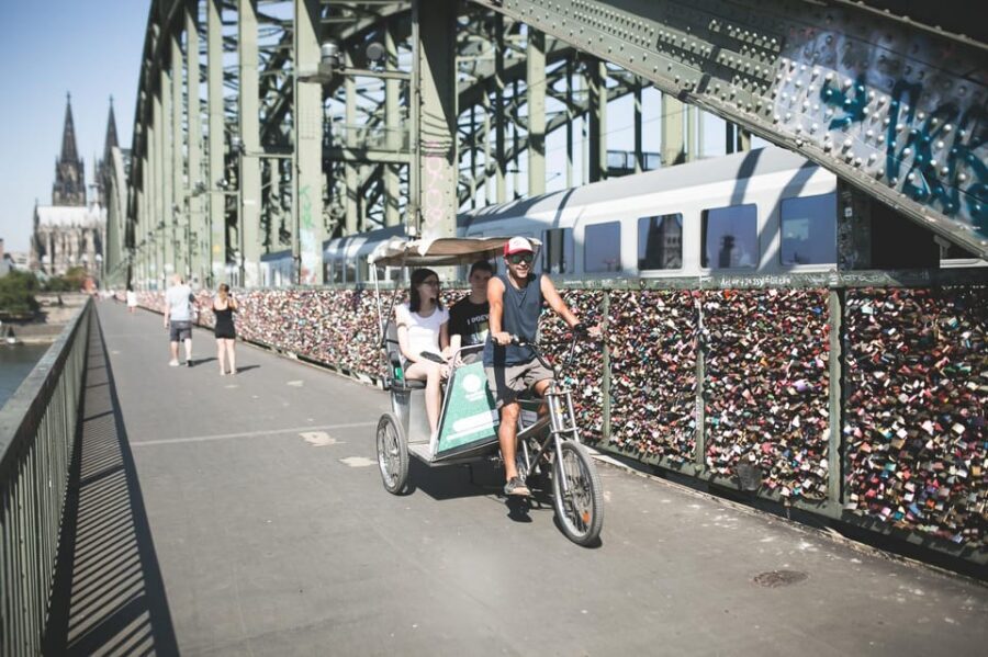 Cologne: Private Rickshaw Tour - Heumarkt beer stop and Hohenzollern Bridge viewpoints