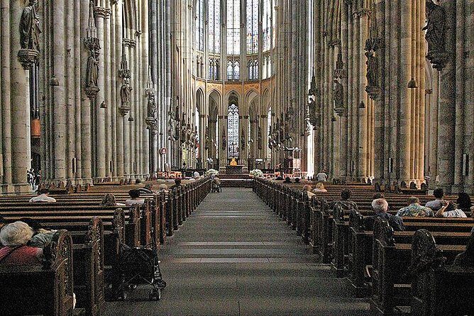 Cologne Walking tour with a visit to world famous Cathedral - Stop 1: Schildergasse—where modern shopping meets old-city bones