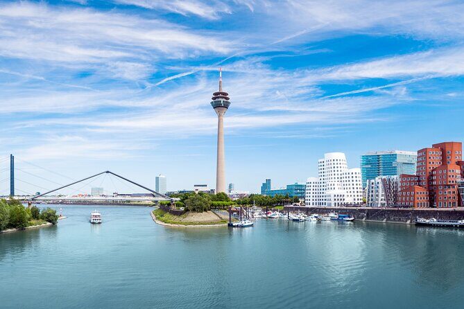 Dusseldorf: City Walk Audio Guide in 7 Languages on your Phone - St. Lambertus Church and that twisted tower