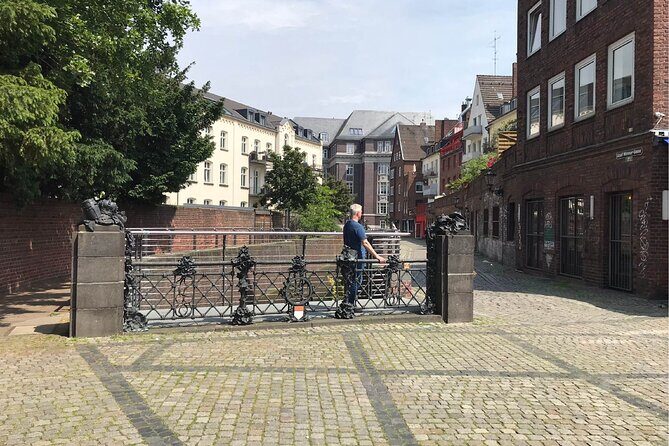 Düsseldorf Walking Tour: Explore Top Sights & Hidden Gems - Rhine Promenade Views: MediaHafen, Oberkassel, and St. Lambertus