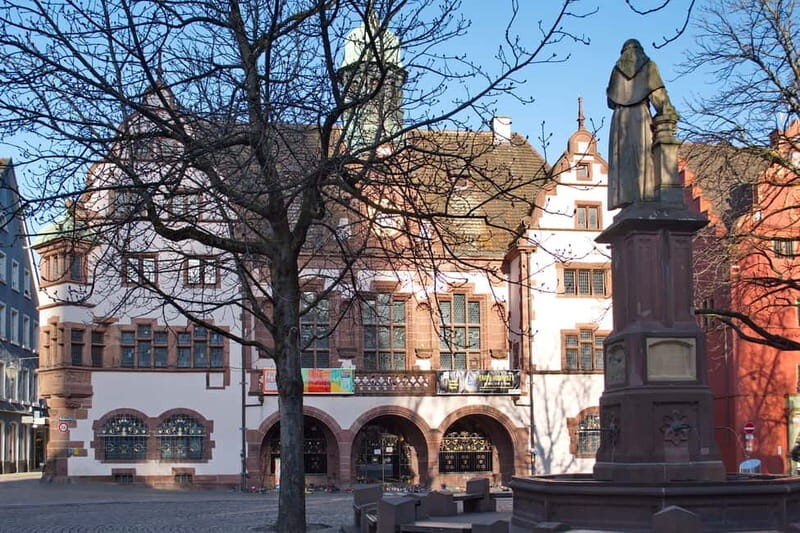 Freiburg City Tour: with visit of the Freiburg Minster - Kaiser-Joseph-Straße and Münsterplatz: street life meets the big church square