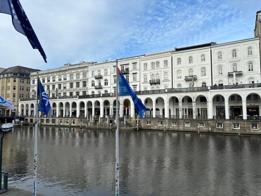 Hamburg: 1-Hour Sightseeing Bus Tour with Live Guide - Reeperbahn and the Fish Market area: neighborhood energy in motion