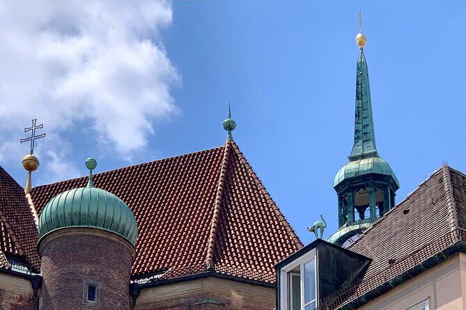 Ten Munich Old town Sights in a Private Express Walking Tour - St. Peter’s Church: 8 Clocks, a Tiara Ritual, and a Cannonball