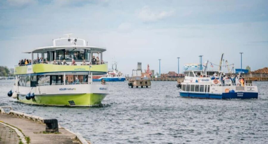Wismar: Electric Boat Tour past Whale Island with Poel Stop - Wismar Bay outbound: ports, piers, and the coastal view from your seat