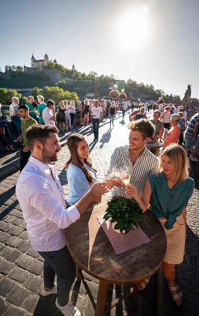 Würzburg: Guided Tour with Franconian wine - Crossing to the Old Main Bridge: Statues, Thoroughfare, and Atmosphere